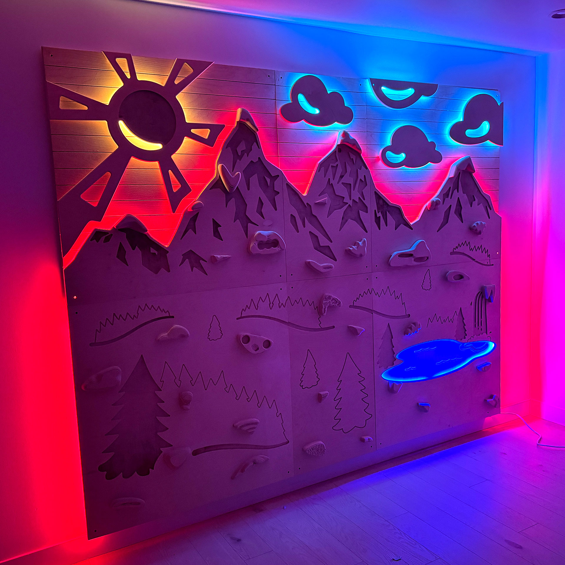 an illuminated, wooden climbing wall